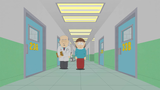 Liane and a doctor walking down one of the hallways