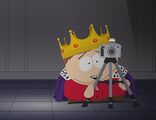 Cartman preparing to take a picture of Kyle sucking his balls.