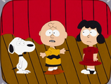 Charlie Brown with Lucy and Snoopy.