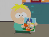 Butters holding a picture of John Elway in "Butters' Very Own Episode".